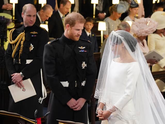 Prince William (left) watching Prince Harry and Meghan Markle during their wedding at St George's Chapel at Windsor Castle. Picture: Jonathan Brady/PA Wire