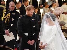 Prince William (left) watching Prince Harry and Meghan Markle during their wedding at St George's Chapel at Windsor Castle. Picture: Jonathan Brady/PA Wire