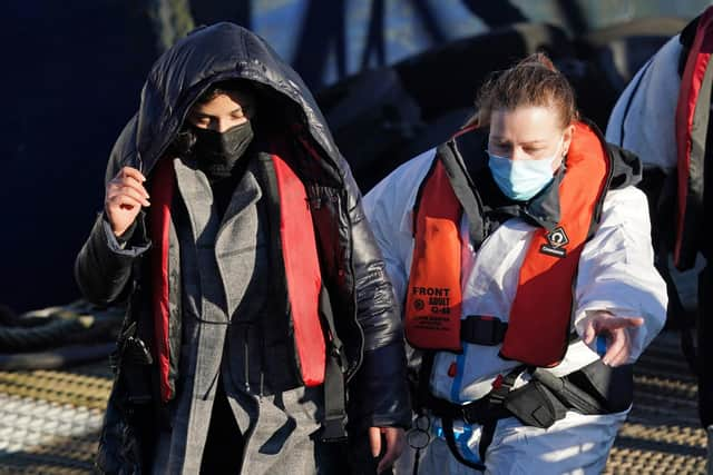 A group of people thought to be migrants are brought in to Dover, Kent, by Border Forcer officers on Thursday. Picture: Gareth Fuller/PA Wire