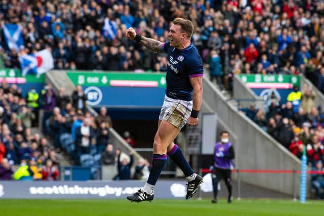 Scotland captain Stuart Hogg jumps for joy after his record-breaking try against Japan at BT Murrayfield. (Photo by Ross Parker / SNS Group)