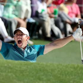 Rory McIlroy reacts after holing a bunker shot on the 72nd hole in the 86th Masters at Augusta National Golf Club. Picture: Gregory Shamus/Getty Images.