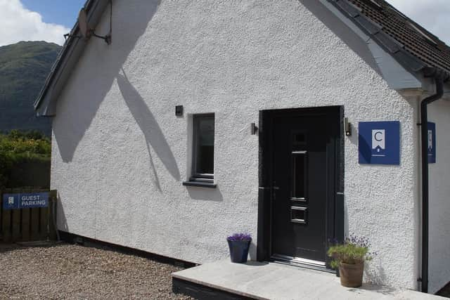 The entrance to The Cottage, with dedicated parking.