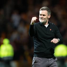 Motherwell manager Graham Alexander celebrates guiding his team into Europe.