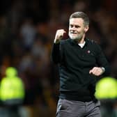 Motherwell manager Graham Alexander celebrates guiding his team into Europe.