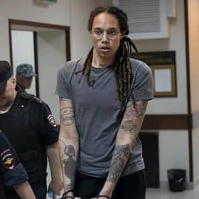 WNBA star and two-time Olympic gold medalist Brittney Griner is escorted from a courtroom .(AP Photo/Alexander Zemlianichenko, File)