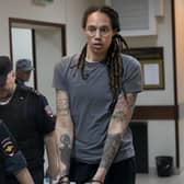 WNBA star and two-time Olympic gold medalist Brittney Griner is escorted from a courtroom .(AP Photo/Alexander Zemlianichenko, File)