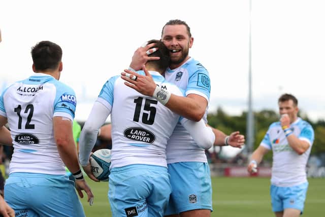 Glasgow Warriors co-captain Ryan Wilson congratulates Cole Forbes on his first try. Picture: Craig Williamson/SNS