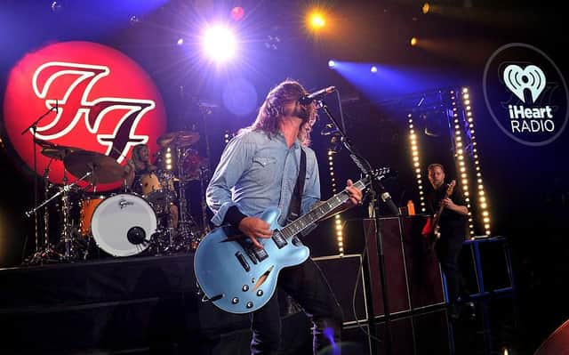 The Foo Fighters perform on stage with the late, great Taylor Hawkins (Photo by Kevin Winter/Getty Images for iHeartMedia)