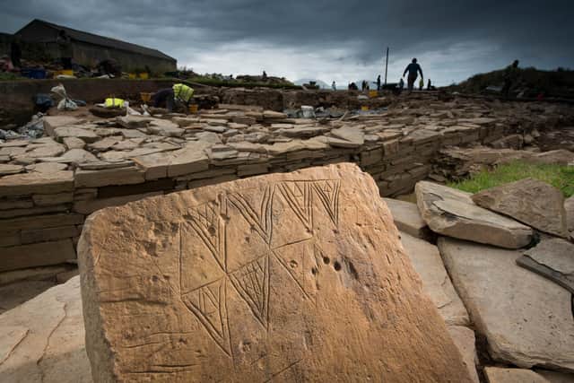 A piece of 'butterfly stone' excavated from the Ness of Brodgar, with the design later found across the country. A piece of the decorated stonework will go on show at the World of Stonehenge exhibition at the British Museum. PIC: Jim Richardson.