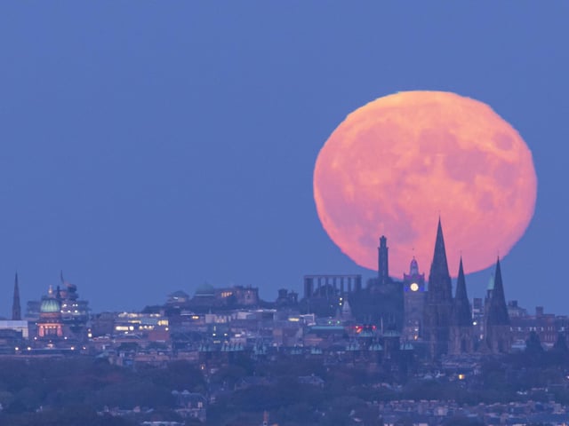 The hunter's moon illuminates the Scottish capital.