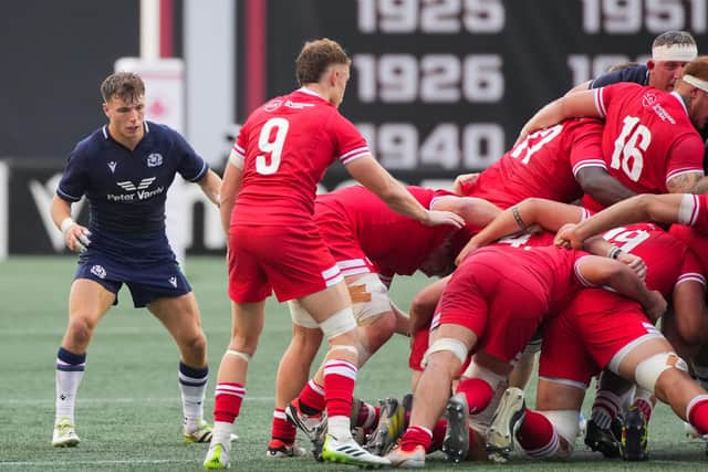Jamie Dobie, left, in action against Canada. It was his first start for Scotland and he marked the occasion with a try. (Photo by Chris Tanouye/Getty Images for Scottish Rugby)