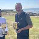 Graham Fox, right, shows off the Northern Open trophy after his win at Moray Golf Club in Lossiemouth, where Ryan Bain claimed the Bookless Trophy as leading amateur. Picture: PGA in Scotland