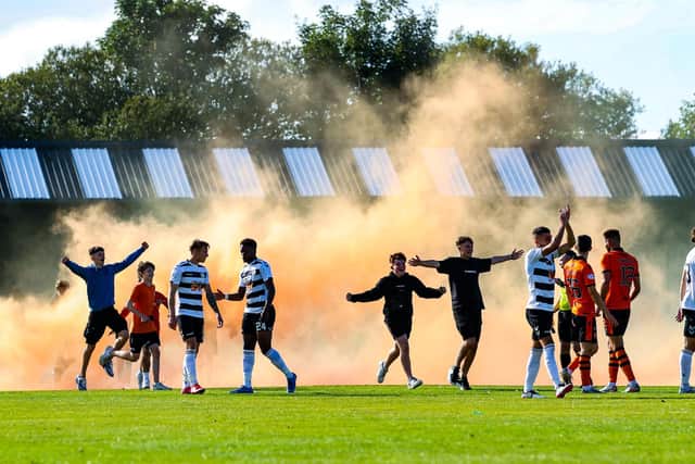 Dundee United fans invade the pitch after their side's shoot-out success over Ayr in the clubs' Premier Sports Cup last 16 tie at Somerset Park. (Photo by Craig Williamson / SNS Group)