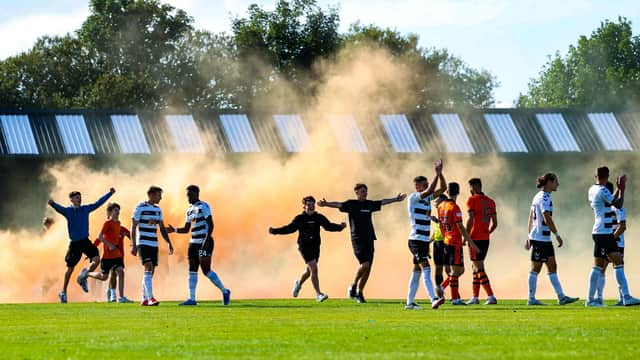 Dundee United fans invade the pitch after their side's shoot-out success over Ayr in the clubs' Premier Sports Cup last 16 tie at Somerset Park. (Photo by Craig Williamson / SNS Group)