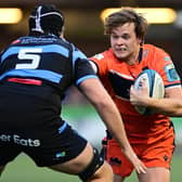 Chris Dean of Edinburgh Rugby under pressure from Rory Thornton of Cardiff Rugby. Photo by Ashley Crowden/INPHO/Shutterstock (13573832al)