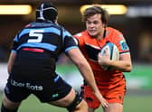 Chris Dean of Edinburgh Rugby under pressure from Rory Thornton of Cardiff Rugby. Photo by Ashley Crowden/INPHO/Shutterstock (13573832al)