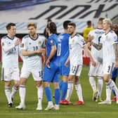 Scotland and Israel players share disappointment at the end of the 1-1 draw in Tel Aviv. (Photo by JACK GUEZ/AFP via Getty Images)