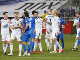 Scotland and Israel players share disappointment at the end of the 1-1 draw in Tel Aviv. (Photo by JACK GUEZ/AFP via Getty Images)
