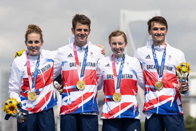 Jessica Learmonth, Jonathon Brownlee, Georgia Taylor-Brown and Alex Yee of Team Great Britain celebrate on the podium during the medal ceremony following their victory in the mixed relay triathlon. Picture: Leon Neal/Getty Images