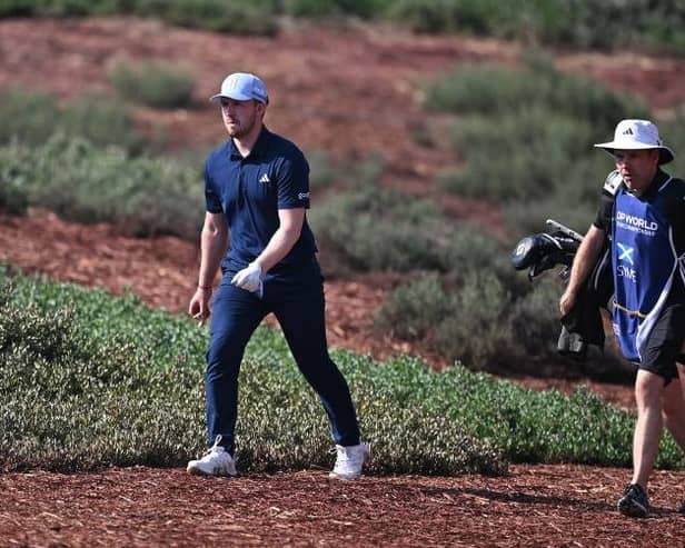 Connor Syme walks with his caddie, Ryan McGuigan, on the Earth Course at Jumeirah Golf Estates during the DP World Tour Championship. Picture: Ross Kinnaird/Getty Images.
