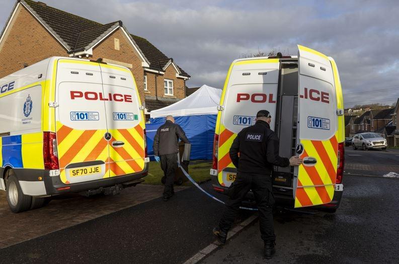 A large blue tent remains in place in the front garden of the property, which has been screened off with blue police screens.