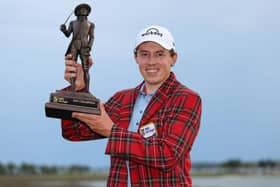 Wearing the winner's Heritage Plaid tartan jacket, Matt Fitzpatrick shows off the RBC Heritage trophy at Harbour Town Golf Links in Hilton Head Island, South Carolina. Picture: Andrew Redington/Getty Images.