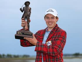 Wearing the winner's Heritage Plaid tartan jacket, Matt Fitzpatrick shows off the RBC Heritage trophy at Harbour Town Golf Links in Hilton Head Island, South Carolina. Picture: Andrew Redington/Getty Images.