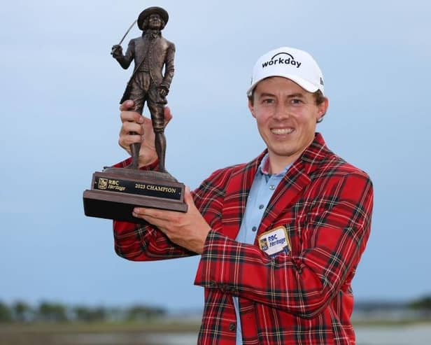 Wearing the winner's Heritage Plaid tartan jacket, Matt Fitzpatrick shows off the RBC Heritage trophy at Harbour Town Golf Links in Hilton Head Island, South Carolina. Picture: Andrew Redington/Getty Images.