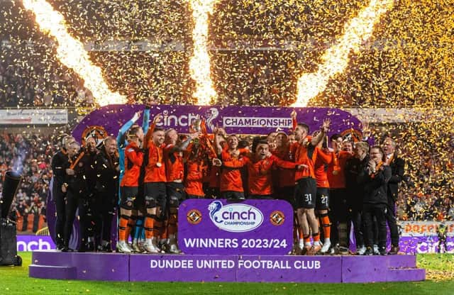 Dundee United lift the cinch Championship 2023/24 trophy following the 4-1 win over Partick Thistle at Tannadice. (Photo by Paul Devlin / SNS Group)