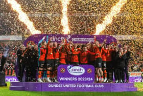 Dundee United lift the cinch Championship 2023/24 trophy following the 4-1 win over Partick Thistle at Tannadice. (Photo by Paul Devlin / SNS Group)