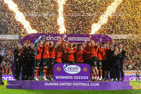 Dundee United lift the cinch Championship 2023/24 trophy following the 4-1 win over Partick Thistle at Tannadice. (Photo by Paul Devlin / SNS Group)