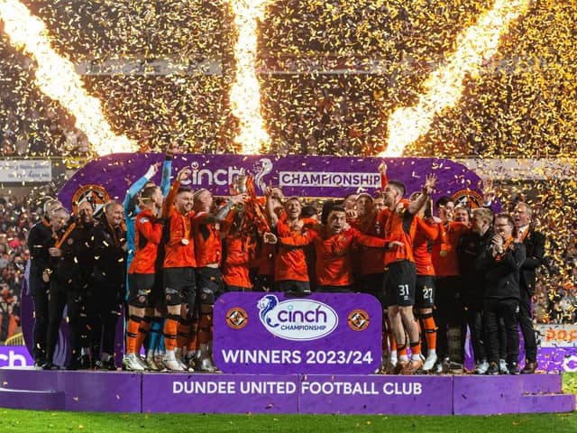 Dundee United lift the cinch Championship 2023/24 trophy following the 4-1 win over Partick Thistle at Tannadice. (Photo by Paul Devlin / SNS Group)
