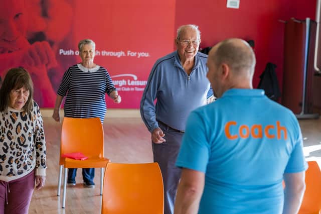 Older adults taking part in an Active Sit class, a chair-based class focusing on improving strength and confidence in everyday movements
