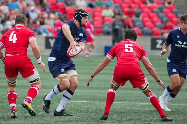 Max Williamson gets his hands on the ball against Canada.