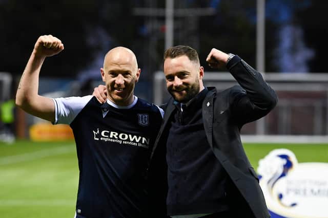 Dundee skipper Charlie Adam and manager James McPake embrace after the Premiership play-off win over Kilmarnock  (Photo by Rob Casey / SNS Group)