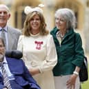 English broadcaster and journalist Kate Garraway stands with her husband Derek Draper and her parents Gordon and Marilyn Garraway, as she poses with their medal after being appointed a Member of the Order of the British Empire (MBE). Picture: Andrew Matthews/AFP via Getty Images
