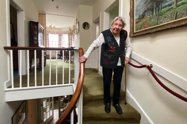 The remarkable Margaret Payne on the stairs of her home in Ardvar, Sutherland. Picture: PA Wire