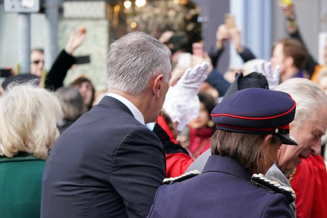 A protester (top left) throws eggs at King Charles III (right) and the Queen Consort (left) as they arrive for a ceremony at Micklegate Bar in York.