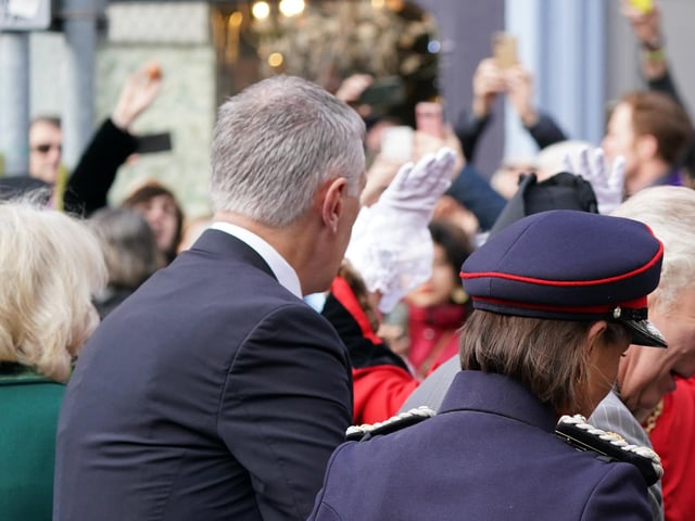 A protester (top left) throws eggs at King Charles III (right) and the Queen Consort (left) as they arrive for a ceremony at Micklegate Bar in York.