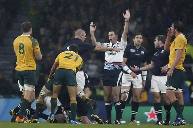 South African referee Craig Joubert (c) awards the controversial final penalty to Australia during the Rugby World Cup quarter final against Scotland. (AFP PHOTO / ADRIAN DENNIS)