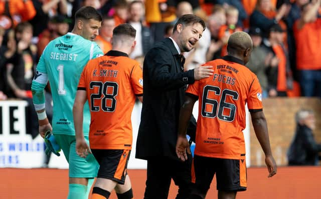 Dundee United manager Tam Courts (left) with Jeando Fuchs, who is playing well under the manager's stewardship.