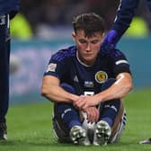 Scotland's Nathan Patterson lies stricken on the turf after injuring his knee in the 3-0 win over Ukraine  (Photo by Craig Foy / SNS Group)