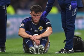 Scotland's Nathan Patterson lies stricken on the turf after injuring his knee in the 3-0 win over Ukraine  (Photo by Craig Foy / SNS Group)