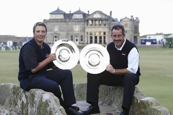 Daniel and Sam Torrance show off their trophies after winning the team competition in the 2003 Alfred Dunhill Links Championship at St Andrews. Picture: Andrew Redington/Getty Images.