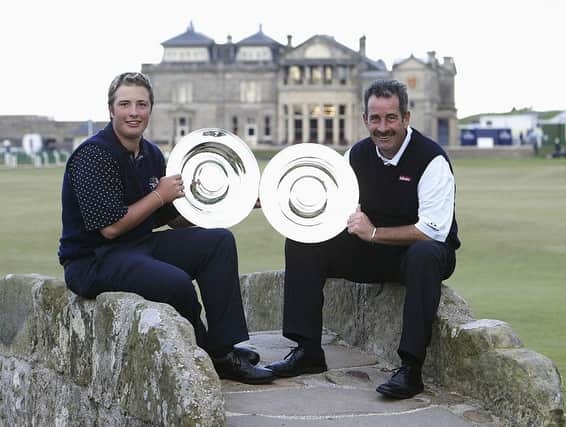 Daniel and Sam Torrance show off their trophies after winning the team competition in the 2003 Alfred Dunhill Links Championship at St Andrews. Picture: Andrew Redington/Getty Images.