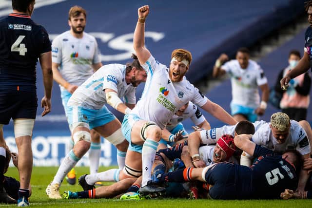 Rob Harley lifts his arm in celebration as Glasgow Warriors hooker George Turner forces his way over for a try. Picture: Ross MacDonald/SNS
