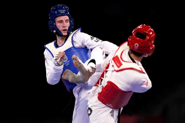 Great Britain's Bradley Sinden takes on Turkey's Hakan Recber during the men's 68kg quarter-final match at Makuharu Messe Hall A in Tokyo. Picture: Mike Egeton/PA Wire