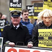 A man dressed as a customs officer and another dressed as Boris Johnson with protesters from Border Communities Against Brexit outside Hillsborough Castle during a visit by Prime Minister Boris Johnson to Northern Ireland for talks with Stormont parties. Picture: Liam McBurney/PA Wire