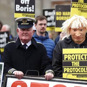 A man dressed as a customs officer and another dressed as Boris Johnson with protesters from Border Communities Against Brexit outside Hillsborough Castle during a visit by Prime Minister Boris Johnson to Northern Ireland for talks with Stormont parties. Picture: Liam McBurney/PA Wire