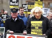 A man dressed as a customs officer and another dressed as Boris Johnson with protesters from Border Communities Against Brexit outside Hillsborough Castle during a visit by Prime Minister Boris Johnson to Northern Ireland for talks with Stormont parties. Picture: Liam McBurney/PA Wire